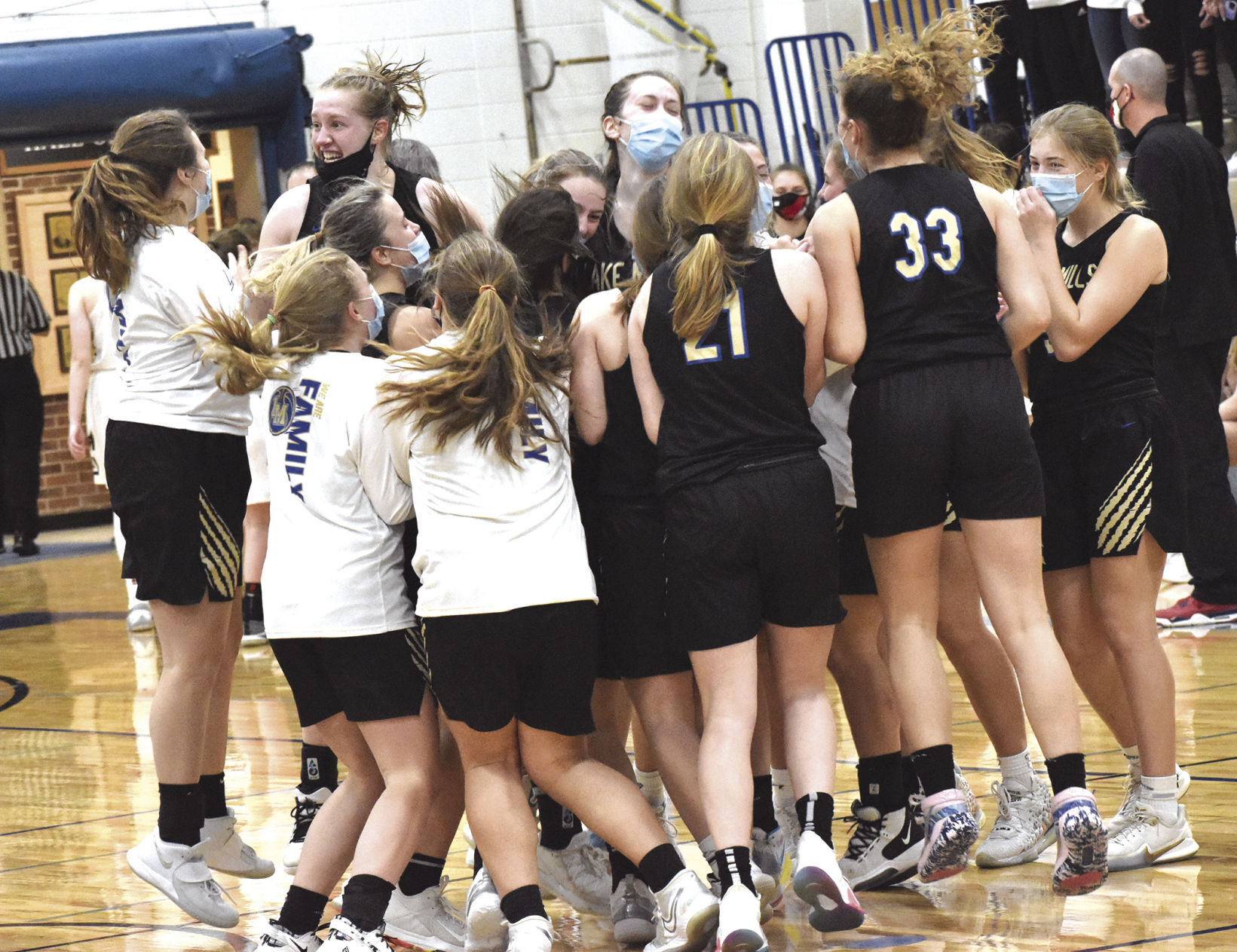 Lake Mills girls basketball celebrates